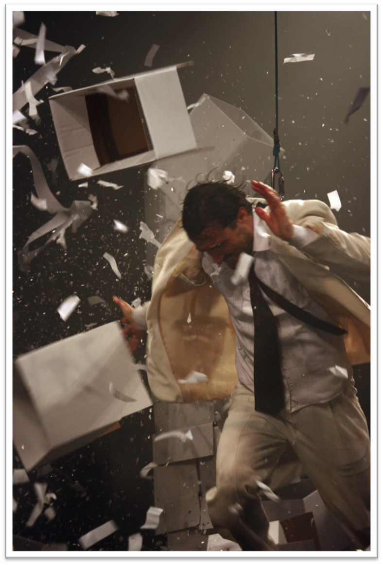 Image - person overwhelmed by paperwork
